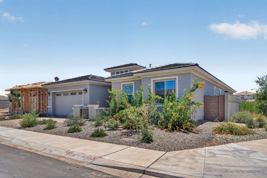 Front exterior of a new home in Stonehaven, Glendale, AZ, highlighting curb appeal (Image 27).