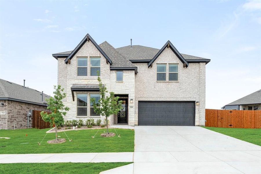 Front exterior of a new home in Star Ranch, Godley, TX, highlighting curb appeal (Image 21).