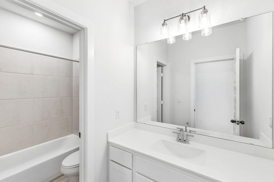 Furnished interior view inside a new home in The Colony, Bastrop (Image 6).
