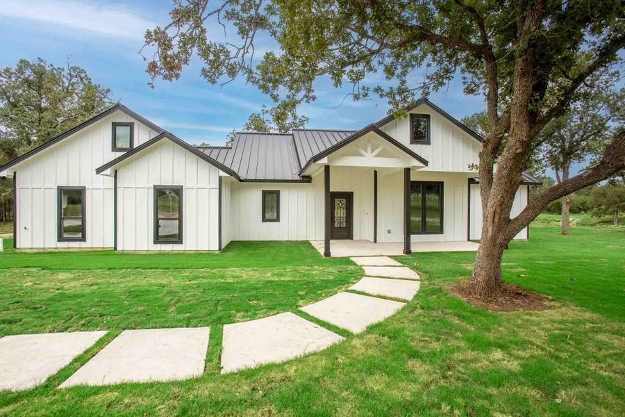 Front exterior of a new home in , Lockhart, TX, highlighting curb appeal (Image 28). Front exterior of a new home in , Lockhart, TX, highlighting curb appeal (Image 28).