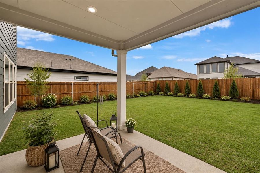 *Virtually Staged* 
Covered patio featuring a concrete slab and recessed lighting