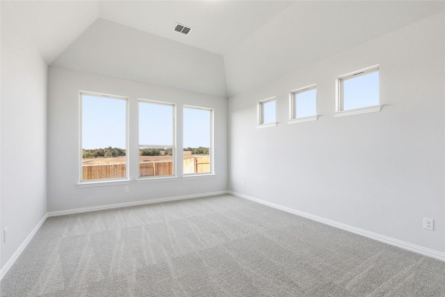 Carpeted empty room featuring baseboards Carpeted empty room featuring baseboards