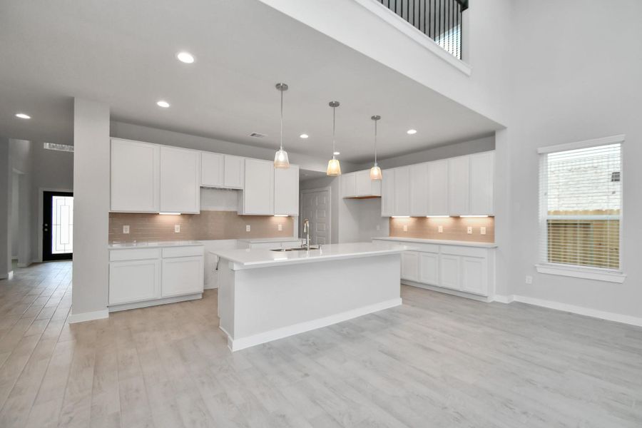 Beautiful bright kitchen space making meal prep enjoyable. Sample photo of completed home with similar floor plan. Actual colors and selections may vary.