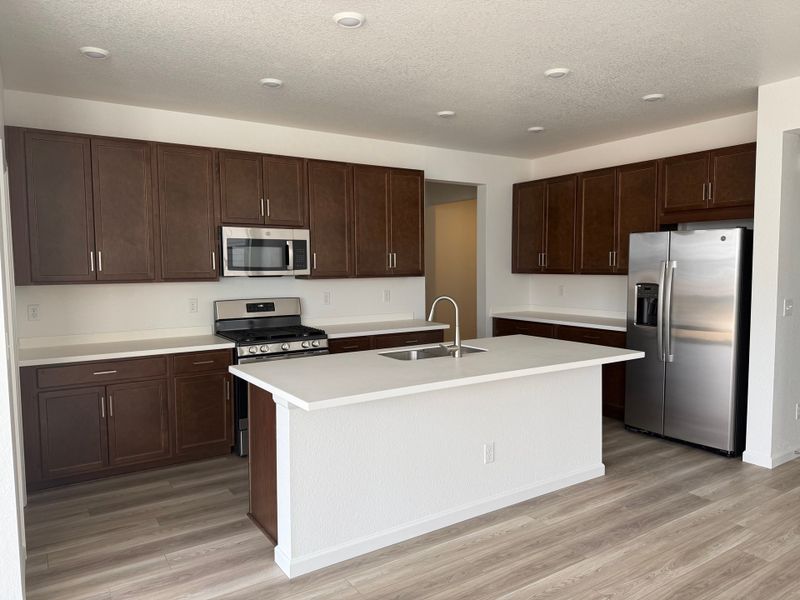 Furnished interior view inside a new home in The Aurora Highlands, Aurora (Image 4).
