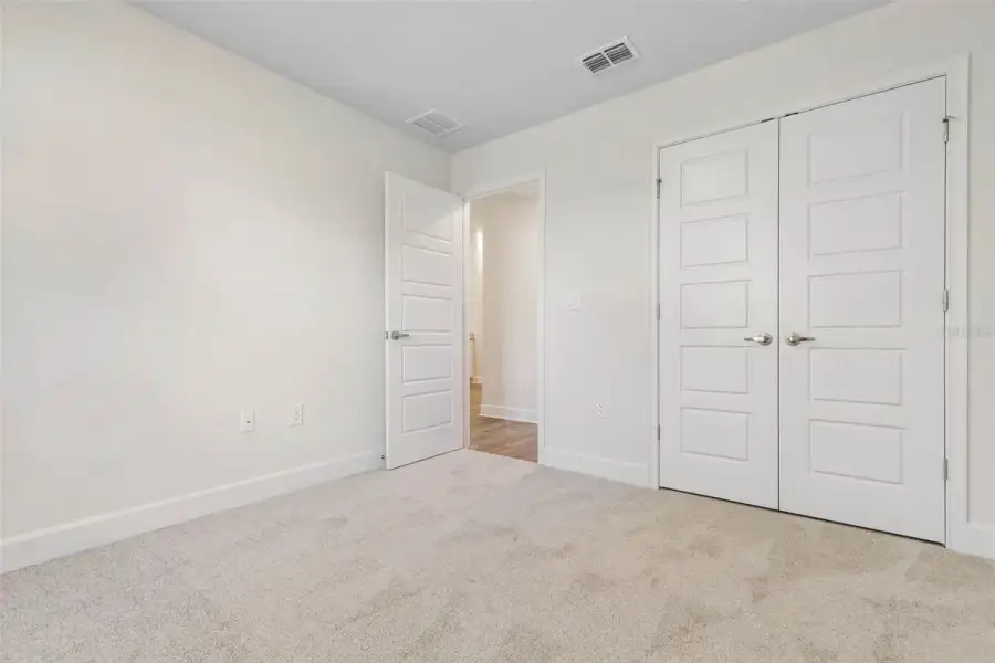 Representative unfurnished interior of a home built from the 2265 by Adams Homes in Flagler Estates, Hastings (Image 51).