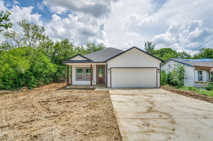 Ranch-style home featuring a garage