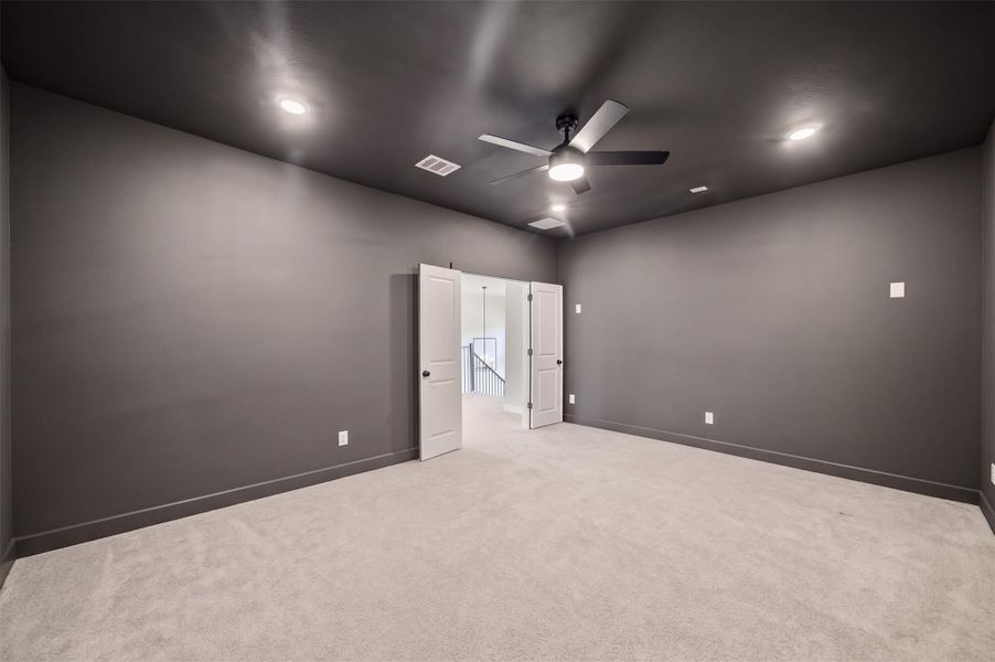 Get your popcorn ready! This home theatre is pre-wired for surround sound and  this dedicated theater room offers a refined setting for an elevated experience.