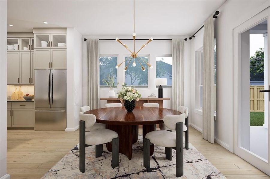 Dining space featuring suspended lighting and light wood-style flooring