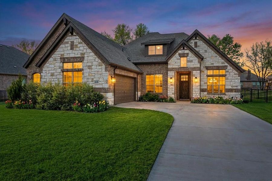 Front exterior of a new home in Abe's Landing, Granbury, TX, highlighting curb appeal (Image 2). Front exterior of a new home in Abe's Landing, Granbury, TX, highlighting curb appeal (Image 2).