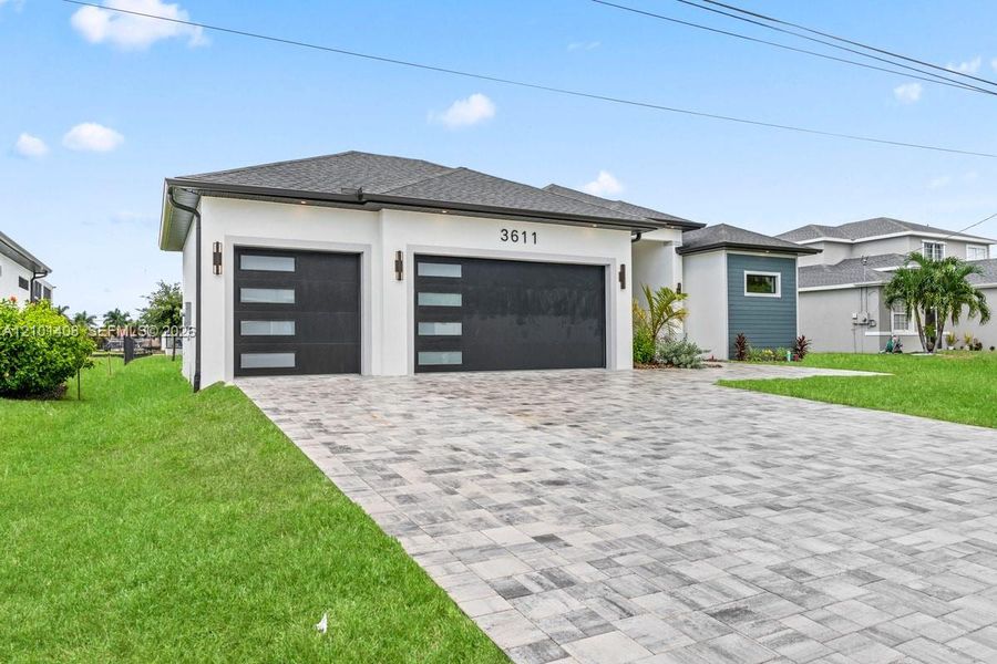 Front exterior of a new home in , Cape Coral, FL, highlighting curb appeal (Image 27).