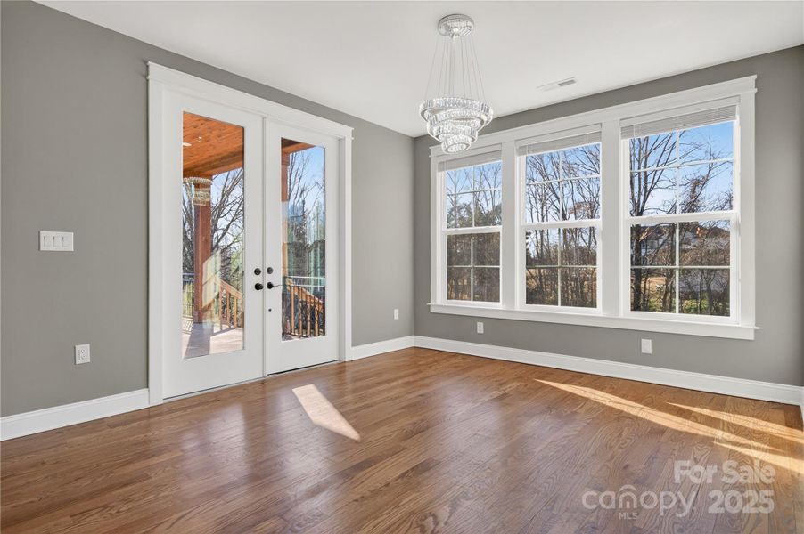 Double doors to the back porch from the dining area