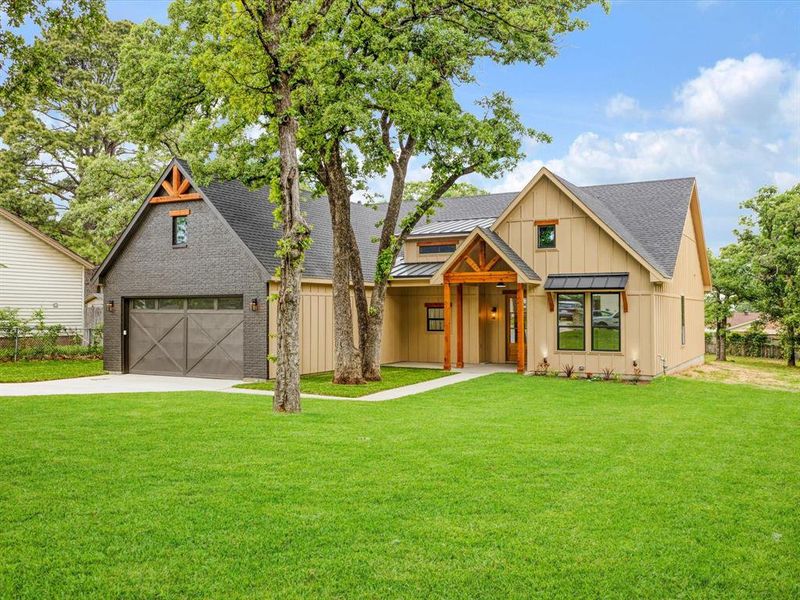 Front exterior of a new home in , Kennedale, TX, highlighting curb appeal (Image 18).