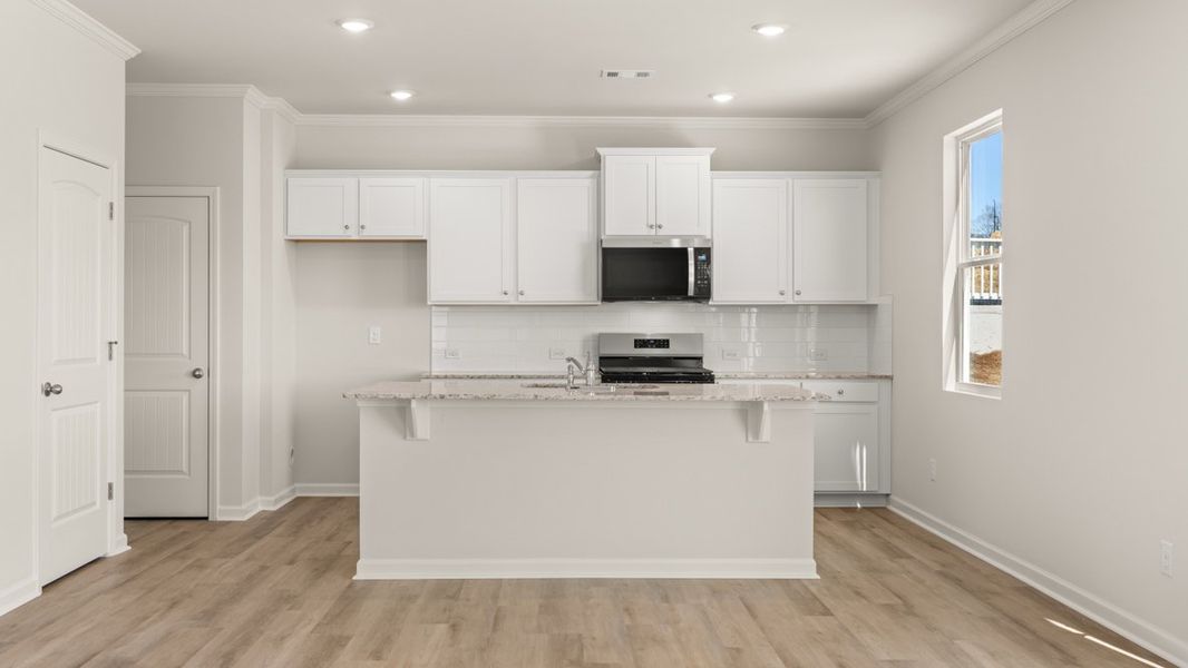 Representative furnished interior of a home built from the Flora by D.R. Horton in Sheffield Highlands, Dallas (Image 7).