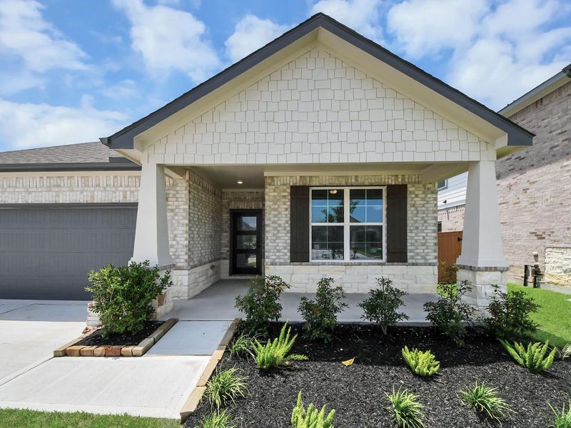 Front exterior of a new home in River Ranch Meadows, Dayton, TX, highlighting curb appeal (Image 2).