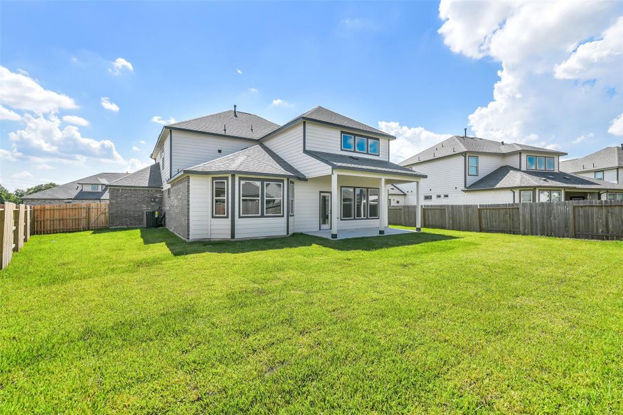 Front exterior of a new home in Stone Creek Ranch, Hockley, TX, highlighting curb appeal (Image 25). Front exterior of a new home in Stone Creek Ranch, Hockley, TX, highlighting curb appeal (Image 25).