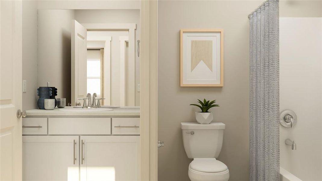 Bathroom featuring toilet and vanity Bathroom featuring toilet and vanity