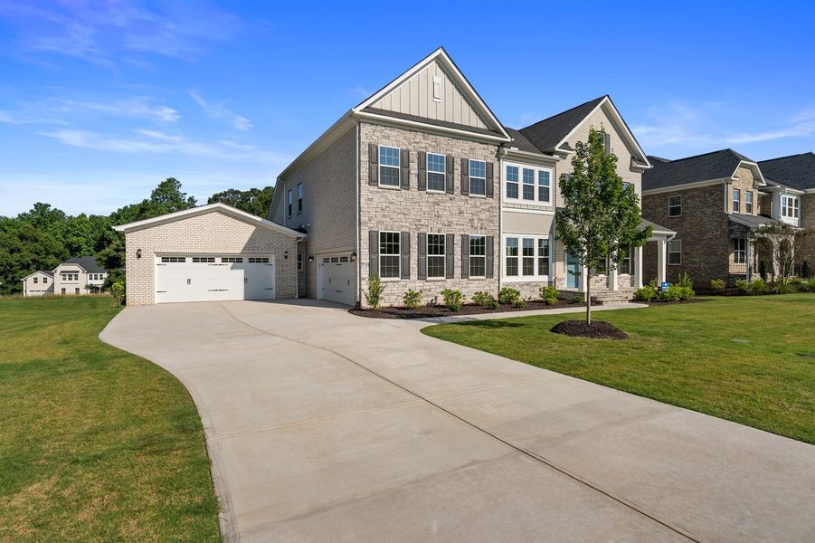 Front exterior of a new home in Walnut Grove, Easley, SC, highlighting curb appeal (Image 2). Front exterior of a new home in Walnut Grove, Easley, SC, highlighting curb appeal (Image 2).