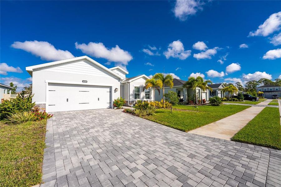 Front exterior of a new home in , Port Charlotte, FL, highlighting curb appeal (Image 23).