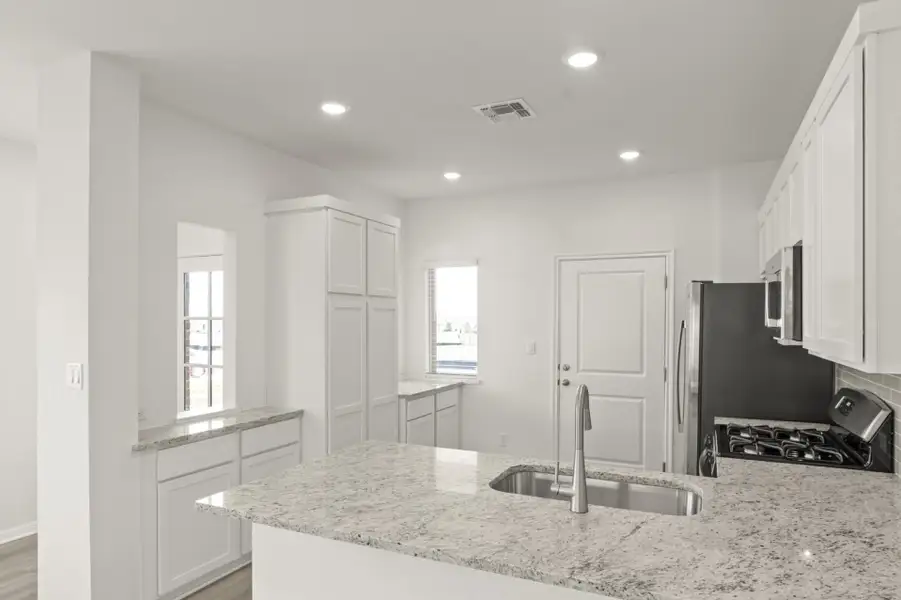 Furnished interior view inside a new home in Grande Estates, Bertram (Image 4).