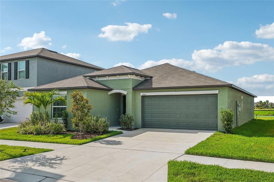 Front exterior of a new home in , Riverview, FL, highlighting curb appeal (Image 20).