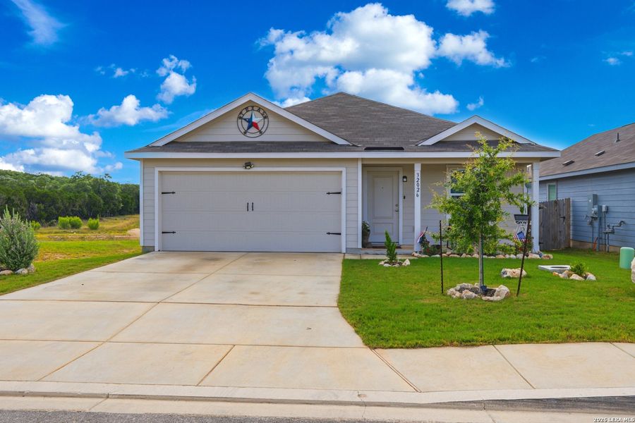 Front exterior of a new home in Hidden Trails, Bulverde, TX, highlighting curb appeal (Image 1). Front exterior of a new home in Hidden Trails, Bulverde, TX, highlighting curb appeal (Image 1).