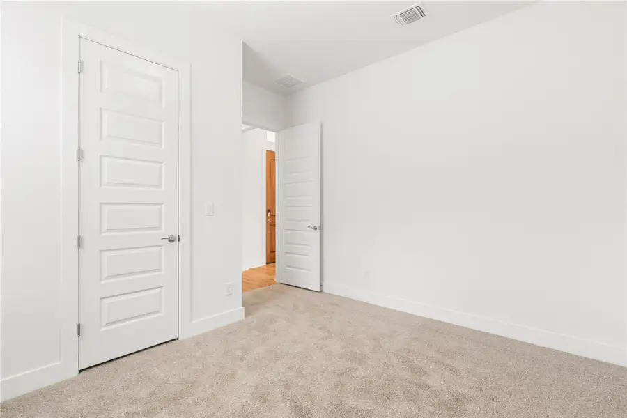 Comfortable carpeting and fresh, unadorned walls await personalization in this inviting space. Comfortable carpeting and fresh, unadorned walls await personalization in this inviting space.