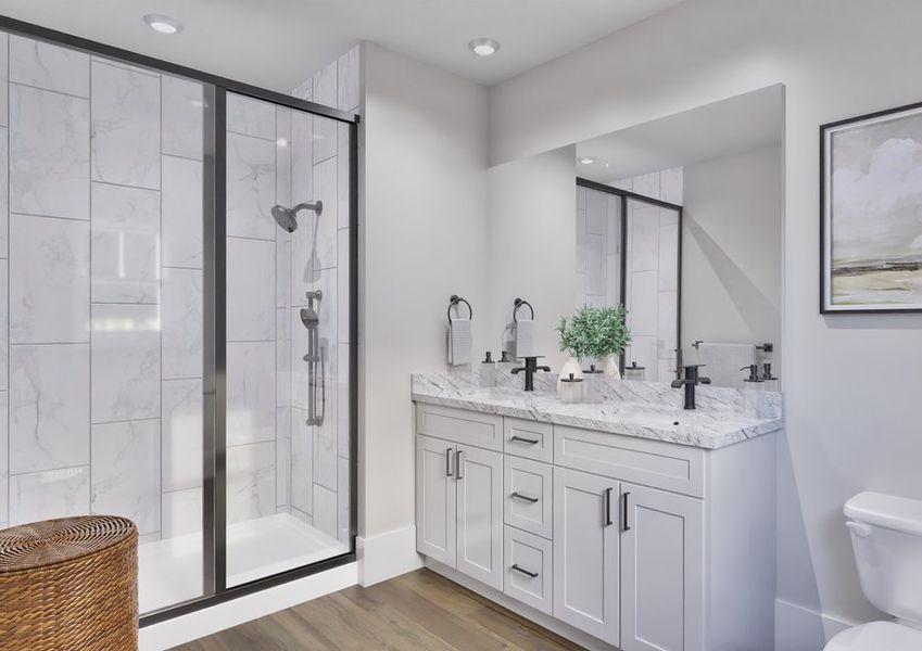 Elegant master bathroom in the Birch model home with dual sinks and a walk-in shower.