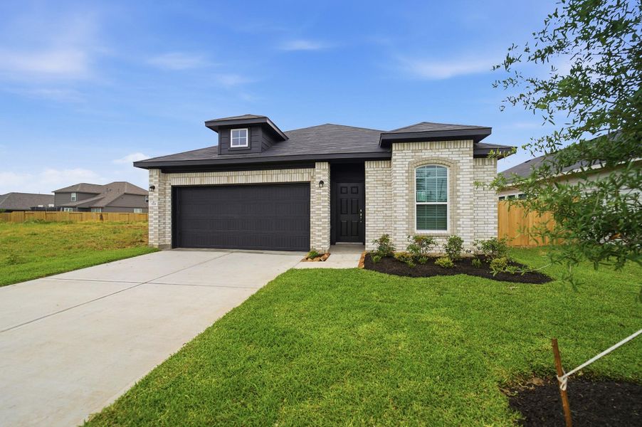 Front exterior of a new home in Trails at Woodhaven Lakes, La Marque, TX, highlighting curb appeal (Image 18).