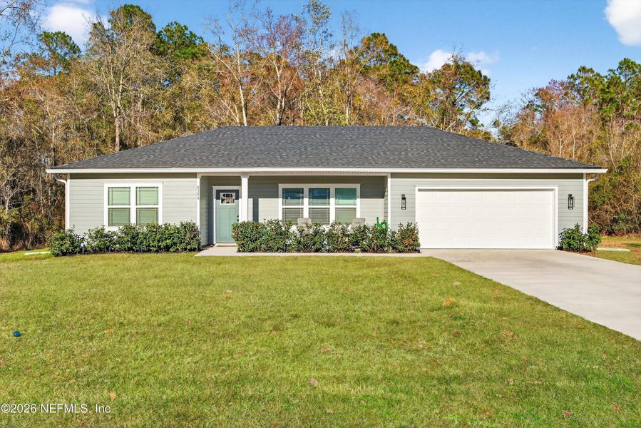Front exterior of a new home in , Middleburg, FL, highlighting curb appeal (Image 21).