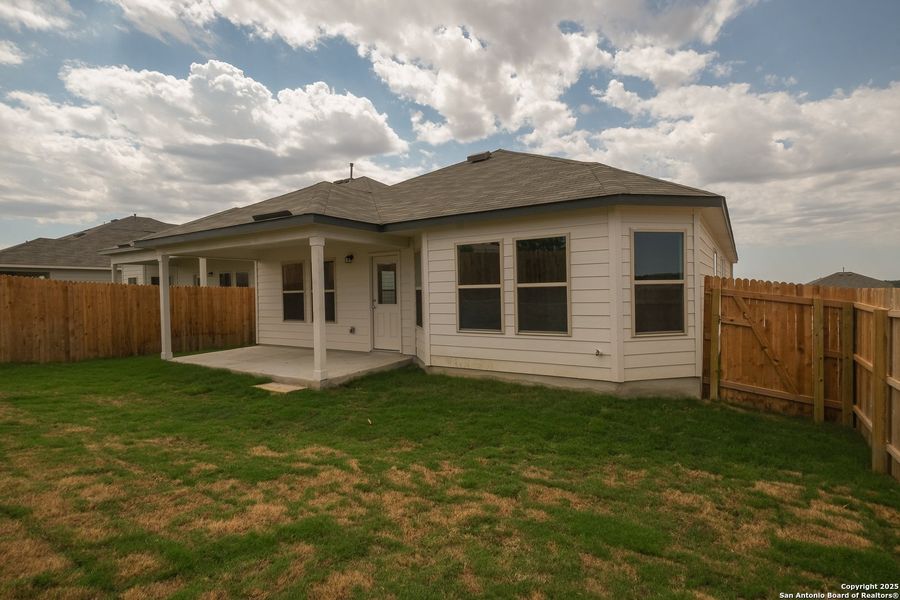 Front exterior of a new home in Hunters Ranch, San Antonio, TX, highlighting curb appeal (Image 2). Front exterior of a new home in Hunters Ranch, San Antonio, TX, highlighting curb appeal (Image 2).