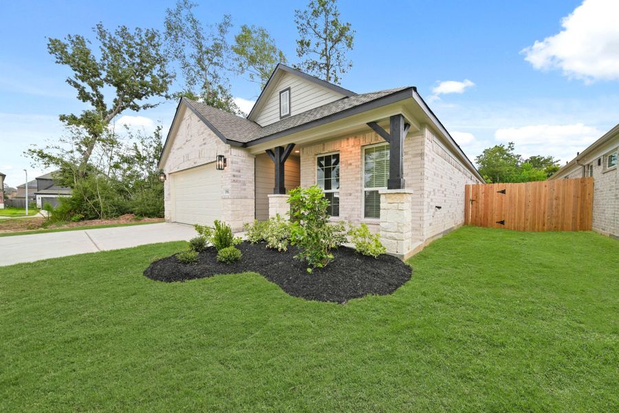 Front exterior of a new home in Barton Creek Ranch, Conroe, TX, highlighting curb appeal (Image 1). Front exterior of a new home in Barton Creek Ranch, Conroe, TX, highlighting curb appeal (Image 1).