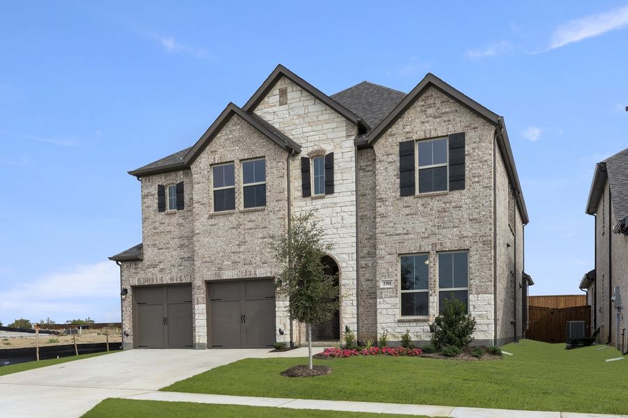 Front exterior of a new home in Brookshire at Legacy Hills, Celina, TX, highlighting curb appeal (Image 2). Front exterior of a new home in Brookshire at Legacy Hills, Celina, TX, highlighting curb appeal (Image 2).