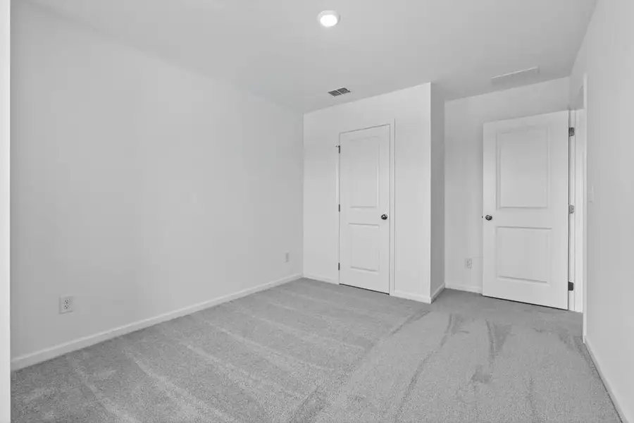 Spacious, unfurnished interior of a new home in Weatherfield, Buford (Image 28).