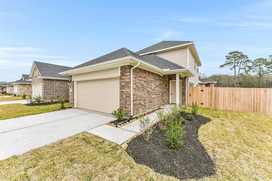 Front exterior of a new home in King Oaks Village, Baytown, TX, highlighting curb appeal (Image 23).