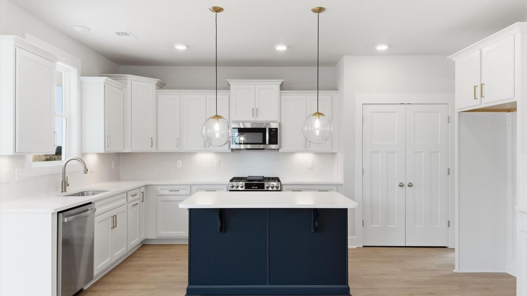 Accomplished layout with a first-class kitchen in this select single family community by DRB Homes
