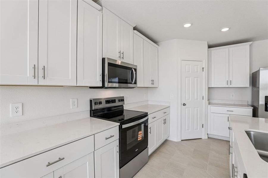 Furnished interior view inside a new home in Lake Deer Estates - Signature Series, Poinciana (Image 13).