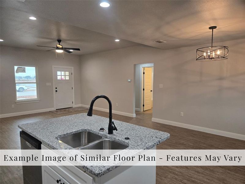 Kitchen featuring open floor plan, recessed lighting, dark wood-style floors, light stone counters, and dishwasher