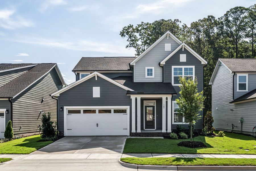 Front exterior of a new home in Serenity - The Village Collection, Fuquay Varina, NC, highlighting curb appeal (Image 1). Front exterior of a new home in Serenity - The Village Collection, Fuquay Varina, NC, highlighting curb appeal (Image 1).