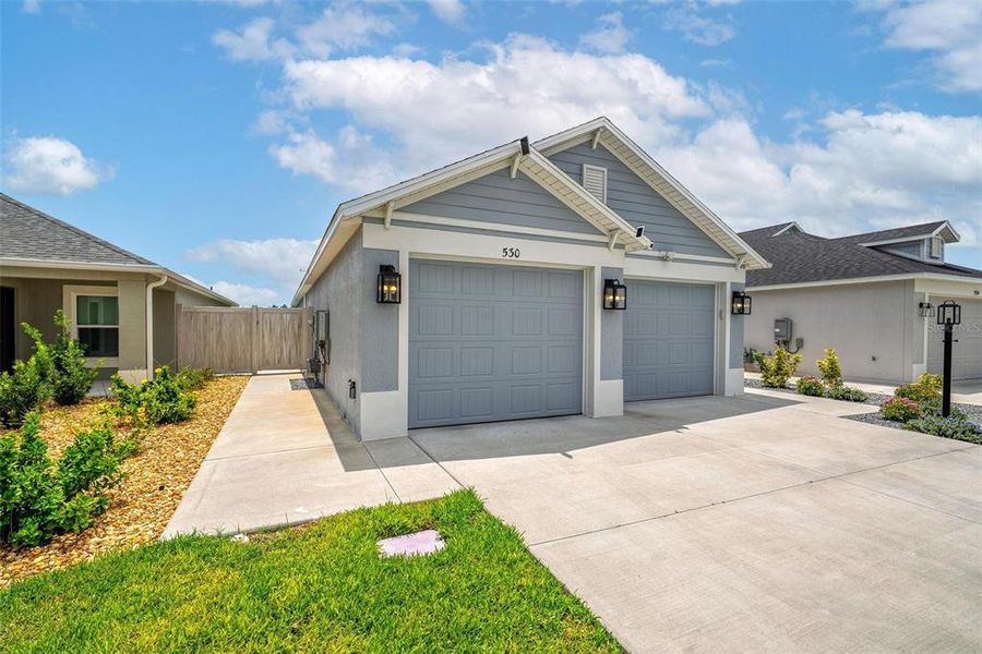Front exterior of a new home in , The Villages, FL, highlighting curb appeal (Image 26).