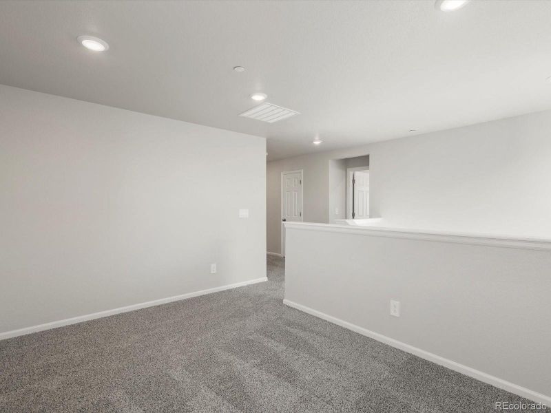 Spacious, unfurnished interior of a new home in Buffalo Highlands: The Flora Collection, Commerce City (Image 17).