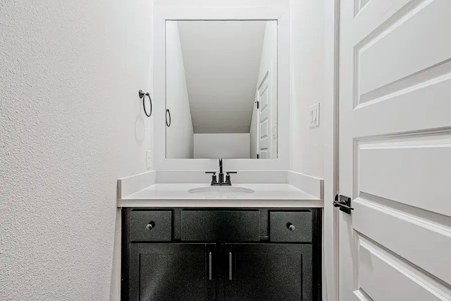 Stylish powder room with modern vanity and clean finishes.