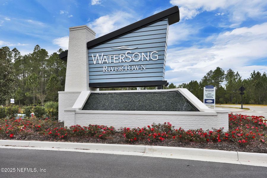 Front exterior of a new home in RiverTown - WaterSong, St. Johns, FL, highlighting curb appeal (Image 24).