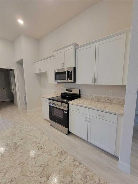 Furnished interior view inside a new home in Ocala Waterway / Kingsland Country Estates, Dunnellon (Image 4).