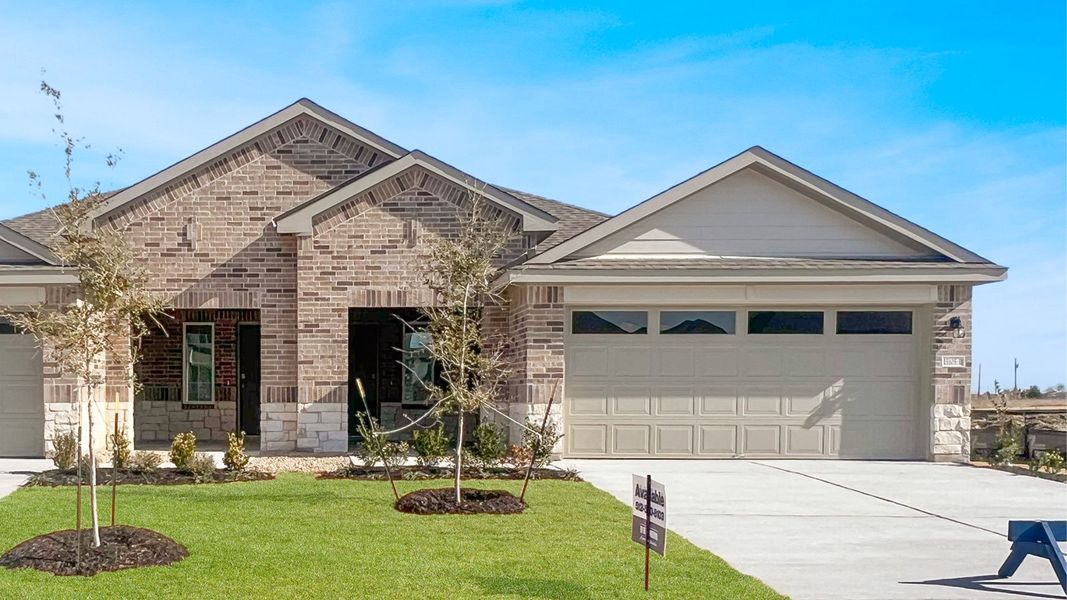 Front exterior of a new home in Palomino, Manor, TX, highlighting curb appeal (Image 1). Front exterior of a new home in Palomino, Manor, TX, highlighting curb appeal (Image 1).