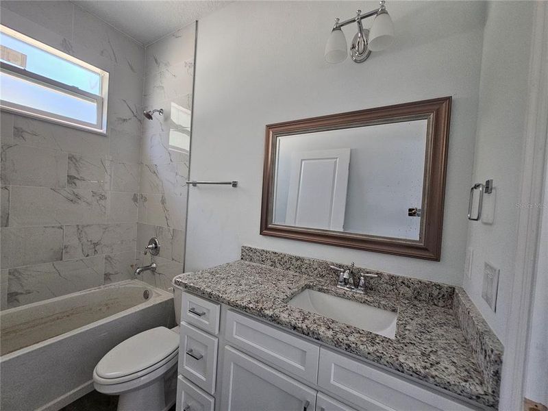 Shared hall Bathroom with Oversized Vanity