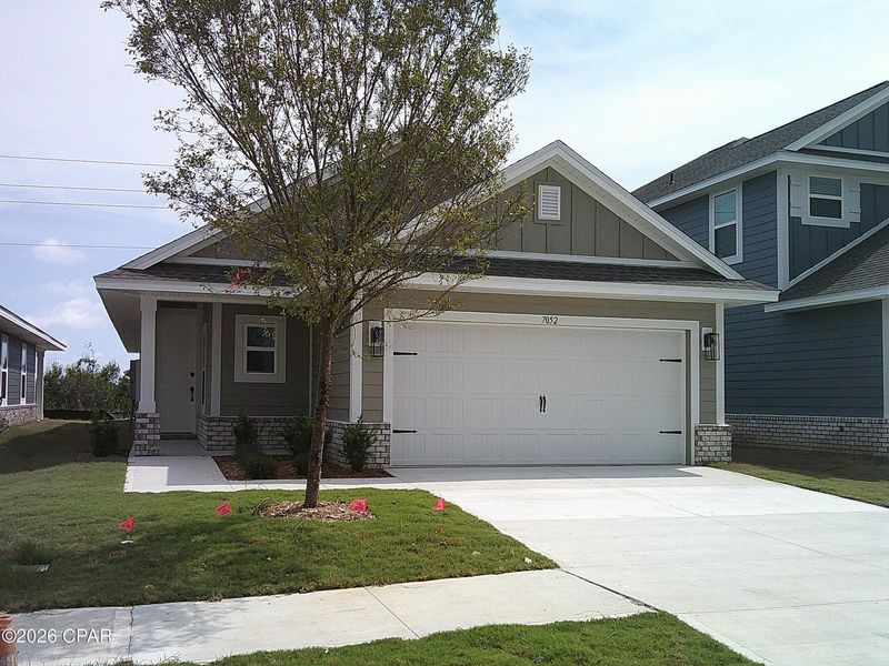 Front exterior of a new home in Parkbrook, Panama City, FL, highlighting curb appeal (Image 1). Front exterior of a new home in Parkbrook, Panama City, FL, highlighting curb appeal (Image 1).