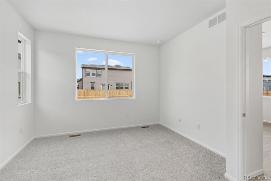 Spacious, unfurnished interior of a new home in The Cottages Collection at Ridgeline Vista, Brighton (Image 19).