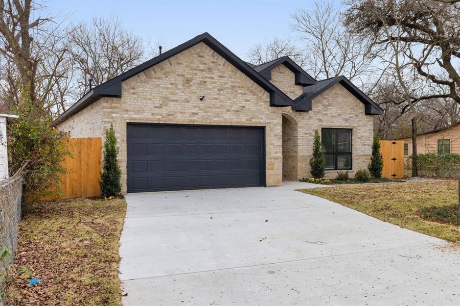 View of front of home featuring a garage