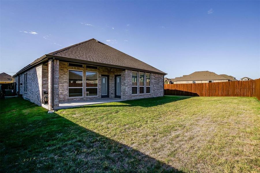 Rear view of house featuring a covered patio