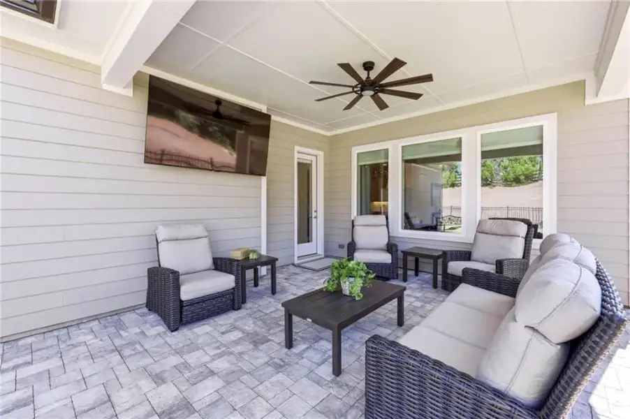 Exterior details and patio area of a home in The Retreat at Sterling on the Lake 48', Flowery Branch (Image 29).